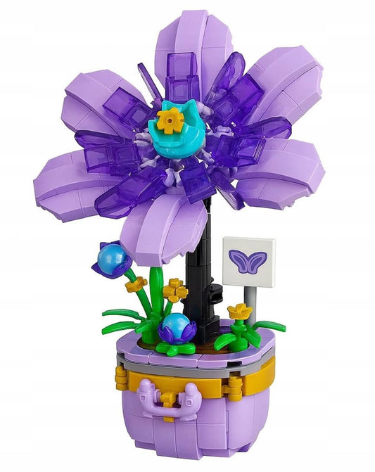 Декоративный конструктор «Фиолетовый цветок» от Sovabooks с нежными лепестками на белом фоне.