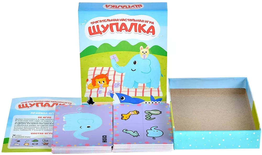 Настольная игра Щупалка от Sovabooks для развития ловкости и командной игры, изображены игровые компоненты на столе.