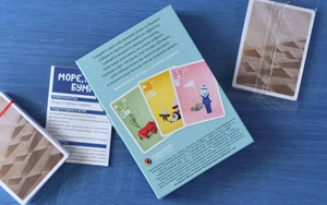 Настольная игра "Море, соль, бумага" от Sovabooks, изображение коробки с ярким дизайном и игровыми элементами