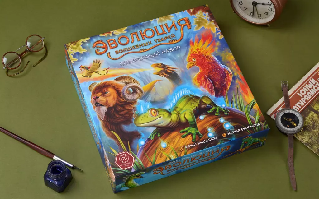 Board game "Evolution of Magical Creatures" by SOVABOOKS featuring colorful illustrated game components and creature cards.