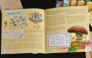Настольная игра "Детектив Кейти" от Sovabooks с изображением игрового поля и карточек для детективных расследований.