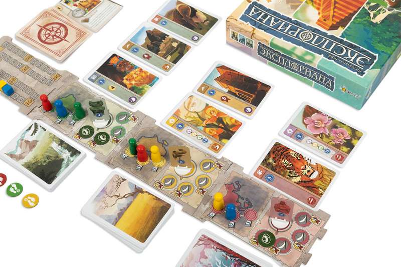 Настольная игра Эксплориана от Sovabooks, семейная настолка с яркими игровыми компонентами и красочной упаковкой.