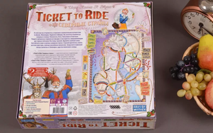 Настольная стратегическая игра Ticket to Ride: Северные страны от Sovabooks, изображение коробки игры и игрового поля.