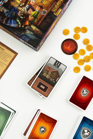 Настольная игра Овербукінг для детей от Sovabooks, изображение игрового поля и компонентов для увлекательной игры.